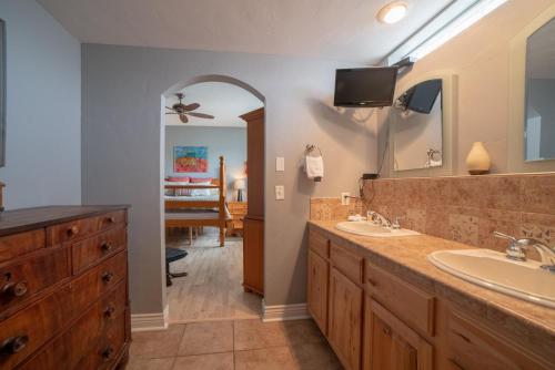 a bathroom with two sinks and a large mirror at Mears House Unit 2D in Durango