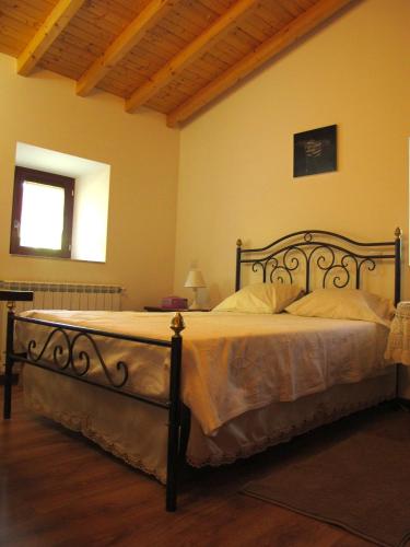 a bedroom with a large bed in a room at Casa das Lapas in Soajo