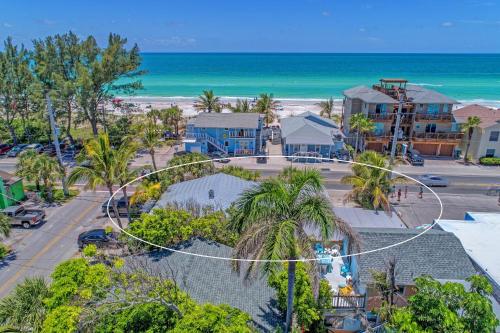 an aerial view of the beach and the ocean at Playa Esmeralda One Bedroom Cottages in Bradenton Beach