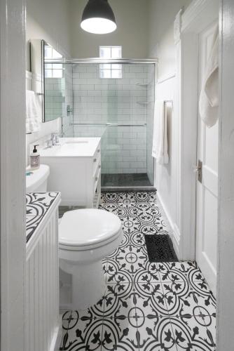 a bathroom with a toilet and a sink and a shower at 2360 Glenarm Place in Denver