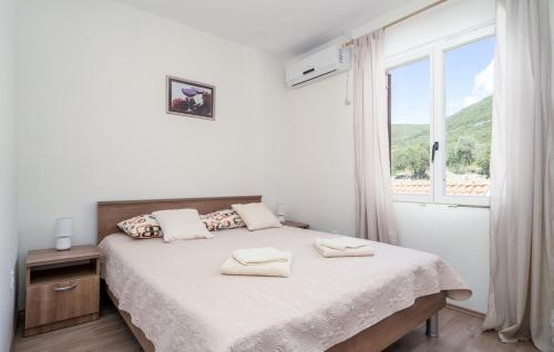 Un pat sau paturi într-o cameră la Apartman Ana Marija
