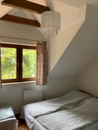 Postel nebo postele na pokoji v ubytování Dom nad jeziorem Mazury pomost segment 2