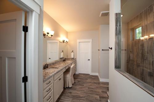 a bathroom with two sinks and a shower at 29 Timberline Drive in Durango