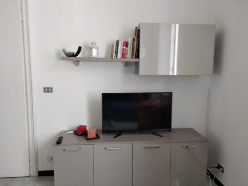 Televízia a/alebo spoločenská miestnosť v ubytovaní Casa Lucia