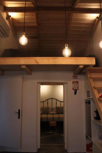a room with two lights hanging from a ceiling at Alma d'Outeiro in Monsaraz