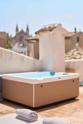 a hot tub on the roof of a house at Can Bordoy Grand House Hotel GL Preferred Hotel in Palma de Mallorca