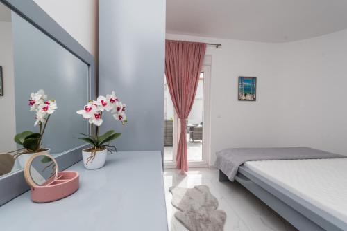 Ένα ή περισσότερα κρεβάτια σε δωμάτιο στο Villa Jana luxury apartments