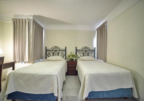 Cama o camas de una habitación en Hotel Francis Drake