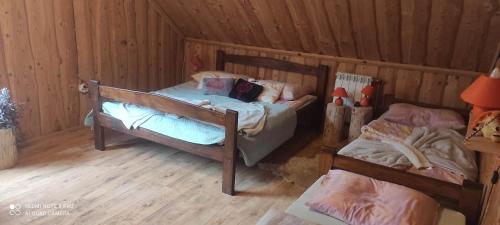 Postel nebo postele na pokoji v ubytování Gospodarstwo Agroturystyczne u Ani