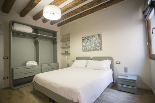 a bedroom with a white bed and a ceiling at Ca' Del Prete - Biennale in Venice