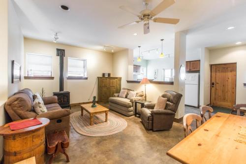 a living room with couches and a table at Mission Rock 2 in Ouray
