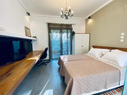a bedroom with a bed and a desk and a fireplace at Small Gem Studio Athens, next to metro nomismatokopeio in Athens