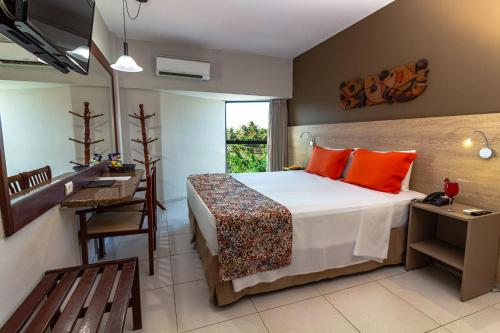 Cama ou camas em um quarto em Littoral Hotel