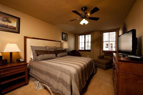 a bedroom with a bed and a ceiling fan at Purgatory Lodge Unit 302 in Durango Mountain Resort