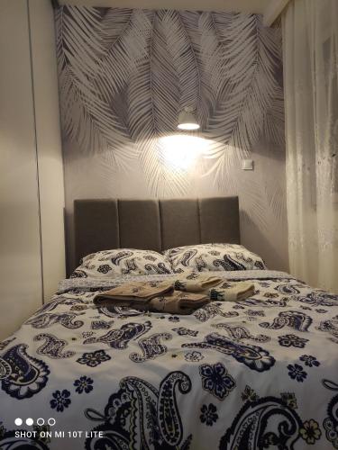 Tempat tidur dalam kamar di Perła Apartament Mińsk