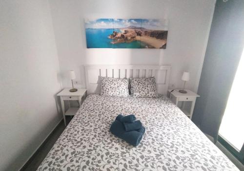 Postel nebo postele na pokoji v ubytování Villa Sun and sea 1 front de mer Playa Rocca Costa Teguise