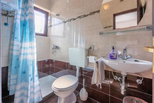 Kúpeľňa v ubytovaní Apartments and Room Ruzica