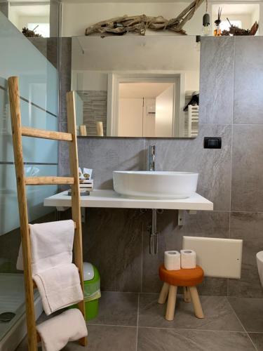 a bathroom with a sink and a mirror at Villa Anna GuestHouse in Brindisi