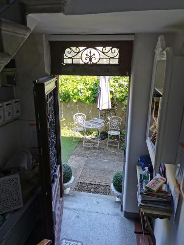 an open door to a patio with a table and chairs at L'Antico Lido Venice in Venice-Lido