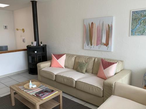 a living room with a couch and a coffee table at Casa Rosa in Rovio