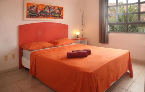 A bed or beds in a room at Residence Village