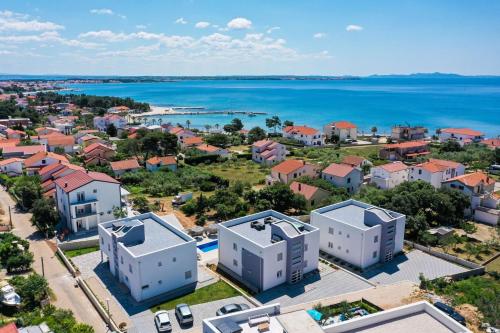 an aerial view of a city with the ocean at 1oak rentals in Vir