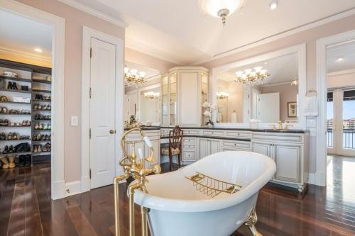 a large bathroom with a tub and a sink at Sarasota Luxury Estate in Sarasota