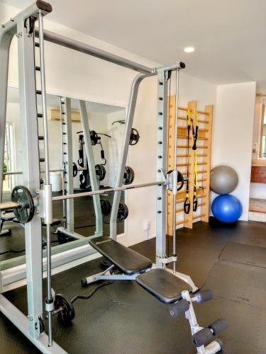 a gym with several tread machines in a room at Sunset Condo 104 Puerta al Mar Isla Mujeres Mexico in Isla Mujeres