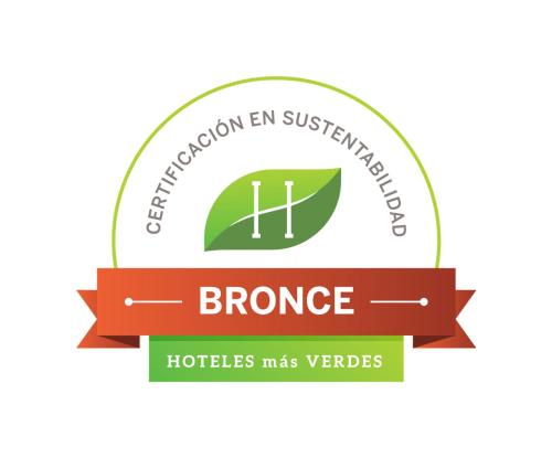 a ribbon for the brogue with a green leaf and the words h infection en at Entre Acequias in General Alvear