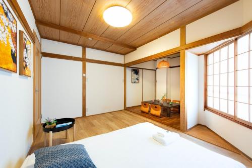 Giường trong phòng chung tại 寅ホテル 台東 Hotel 寅 台东 Tora Hotel Taito D