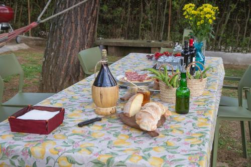 a table with bottles of wine and bread on it at B&B PALAZZI in Florence