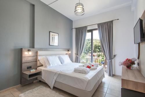Postel nebo postele na pokoji v ubytování Hermes Hotel