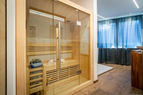 a bathroom with a shower with a glass door at Luxury Apartment Mulino in Merano
