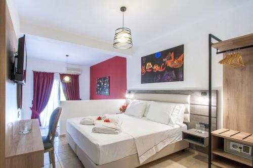 Postel nebo postele na pokoji v ubytování Hermes Hotel