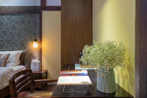 Photo de la galerie de l'établissement Lijiang Gui Yuan Tian Ju Guesthouse, à Lijiang
