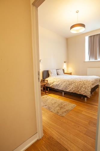 Ένα ή περισσότερα κρεβάτια σε δωμάτιο στο Luxury Suites Castel by Rikas Hotels