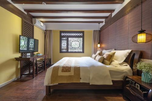 Photo de la galerie de l'établissement Lijiang Gui Yuan Tian Ju Guesthouse, à Lijiang
