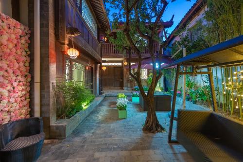 Photo de la galerie de l'établissement Lijiang Gui Yuan Tian Ju Guesthouse, à Lijiang