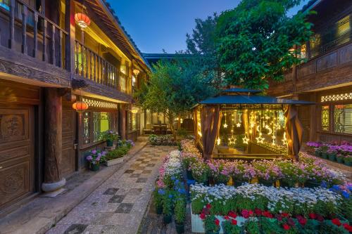 Photo de la galerie de l'établissement Lijiang Gui Yuan Tian Ju Guesthouse, à Lijiang