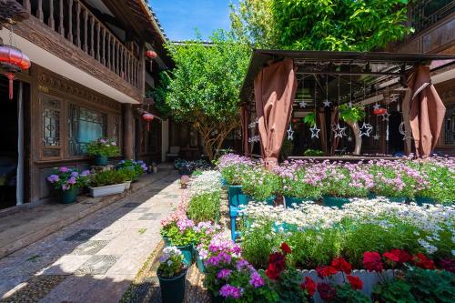 Photo de la galerie de l'établissement Lijiang Gui Yuan Tian Ju Guesthouse, à Lijiang
