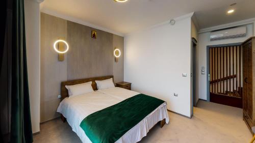 a bedroom with a large bed in a room at HOTEL ANGEL SOFIA in Fălticeni