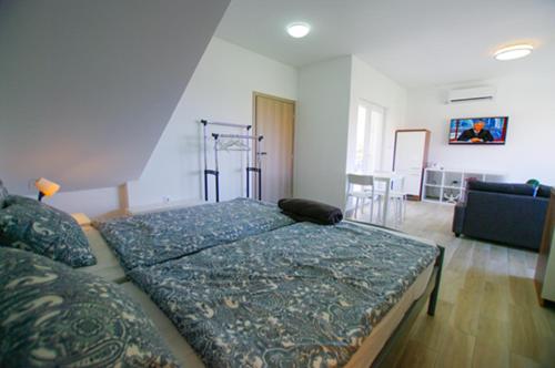 Katil atau katil-katil dalam bilik di Matoc apartments