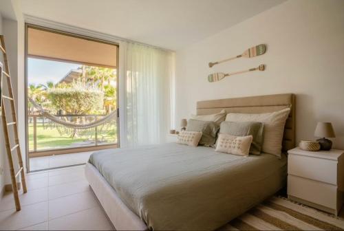 A bed or beds in a room at Casa Praia dos Salgados