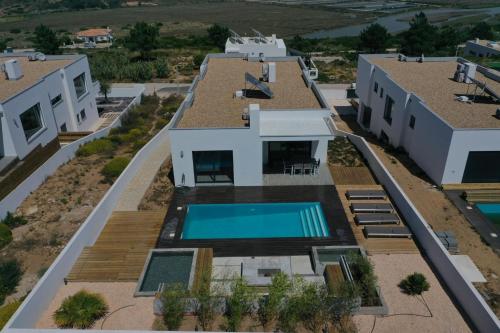 an aerial view of a house with a swimming pool at Cairnvillas: Villa Terra C39 - Luxury Villa with Private Swimming Pool near Beach in Aljezur