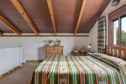 En eller flere senge i et værelse på Casa Miguelin 2