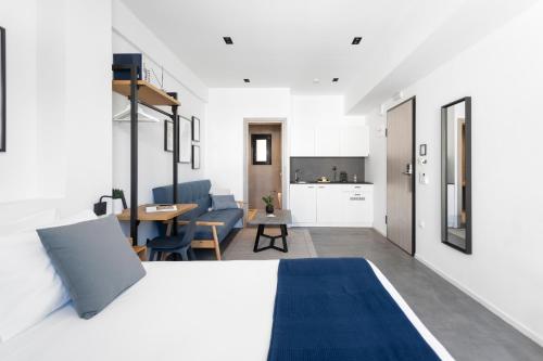 a bedroom with a bed and a living room at PAME House in Athens