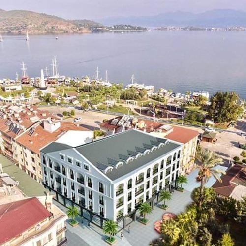 an overhead view of a building with the water in the background at Narac Dom in Fethiye