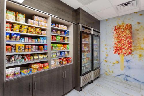 a convenience store aisle with food and drinks at Wingate by Wyndham Tinley Park in Tinley Park