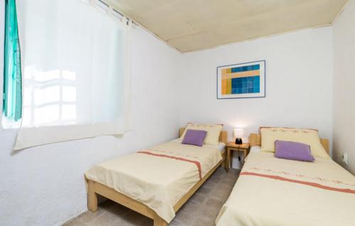 Postel nebo postele na pokoji v ubytování Apartment Sveti Jakov 37