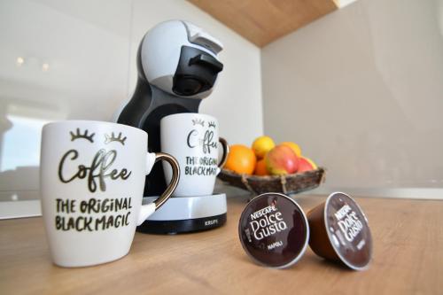 Apartmani Poratにあるコーヒーまたはお茶